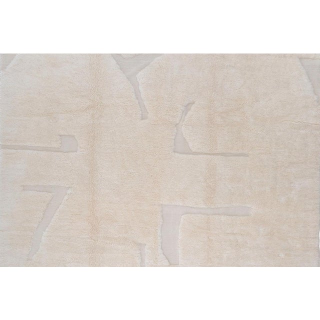 Subtlety with an edge, drawn in tone-on-tone relief. Angular, intersecting lines trace faintly across this piece in soft...