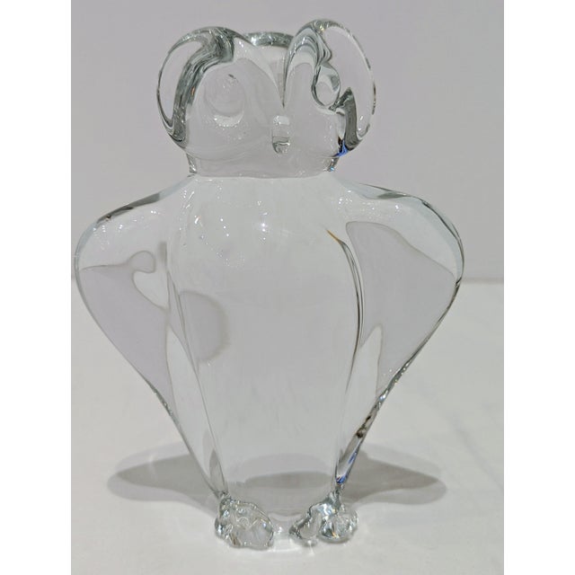 Solid clear glass owl paperweight with sculptural form. The piece dates to the late 1960s or early 1970s, when Nordic...