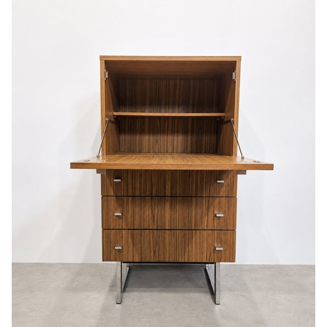 Versatile mid-century vintage highboard combining storage and multiple functions. The main compartment can be used as a...