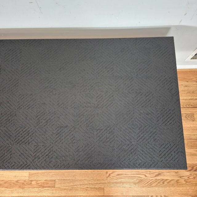 This is a vintage Asian inspired grasscloth coffee table that is newly lacquered in black. The rectangular coffee table is...