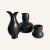 These three pieces designed by Eva Zeisel are glazed earthenware in gunmetal. The carafe and the bulb cup share similar...