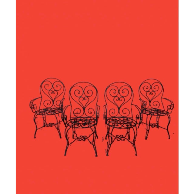 Fantastic hand forged wrought iron black French arm chairs, a timeless design always classic looking. Upgrade the...