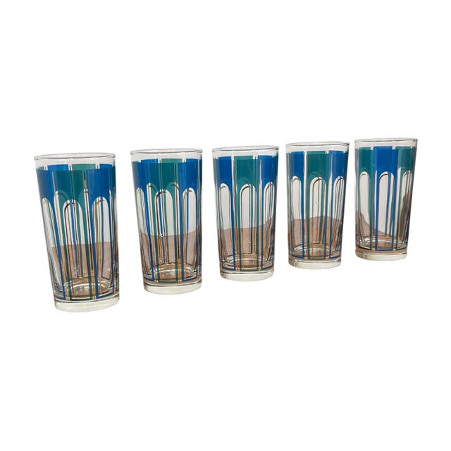 Set of five vintage mid-century modern highball glasses featuring a bold geometric pattern in shades of blue with metallic...