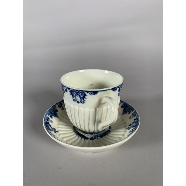 Saint-Cloud Cup and saucer in soft-paste porcelain with raised gadroons and a blue monochrome decoration of flowers on...