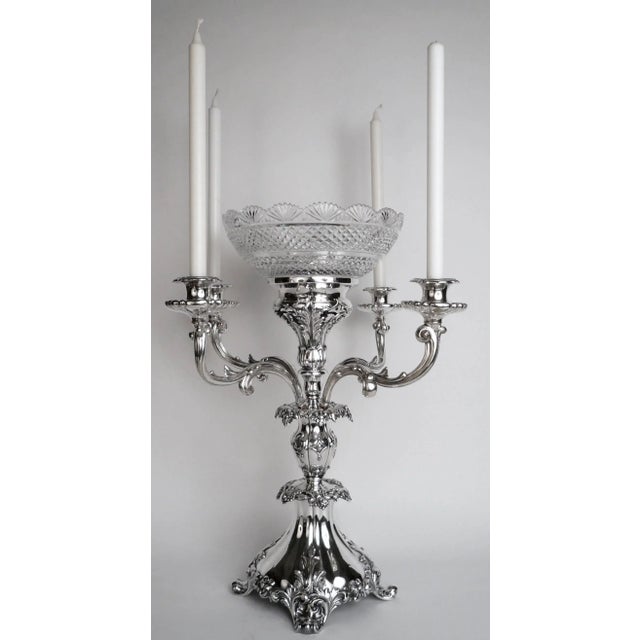 This impressive centerpiece features foliate, and vintage motifs, acanthus leaves, and scroll form feet. The center bowl...