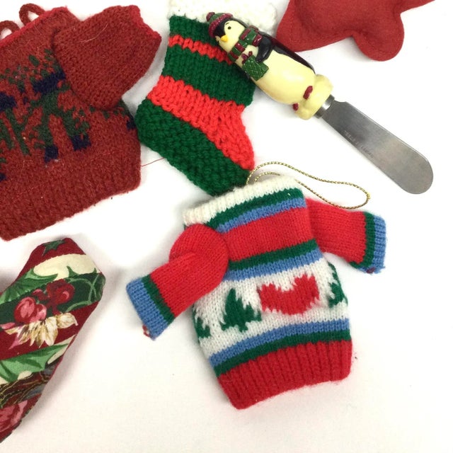 Vintage set of Holiday ornaments all made by hand. Bonus cheese knife. We have 2 hand knit sweaters and a hand knit...