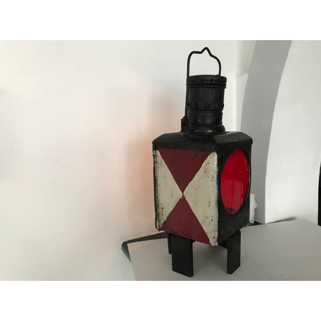 Metal railway lantern from the 1920s Attic. The condition is satisfactory one door is missing. Once upon a time the lamp...