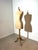 Authentic vintage dress form by Juvenia, featuring a classic feminine silhouette mounted on its original turned wooden...