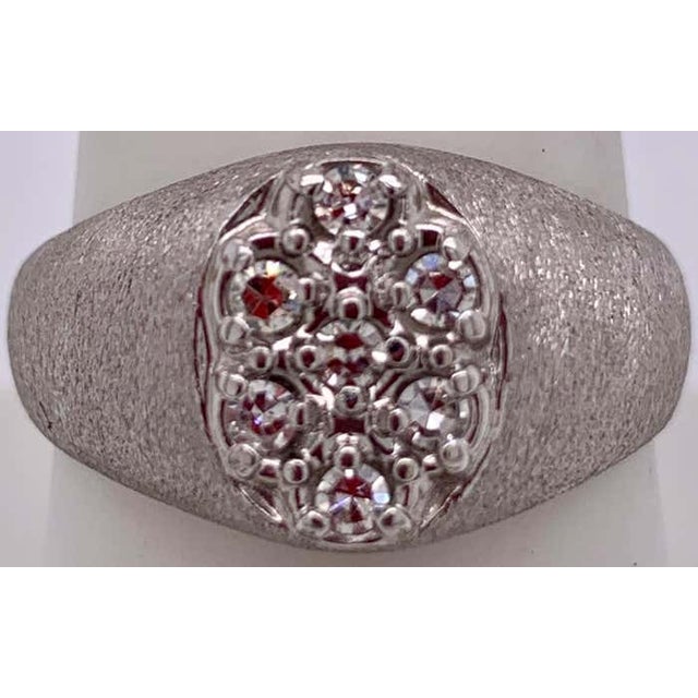 14Kt White Gold Brushed Finish With Diamond Cluster Fashion Ring. Size 7.34. 1.50 Total diamond weight. 12.21 grams total...
