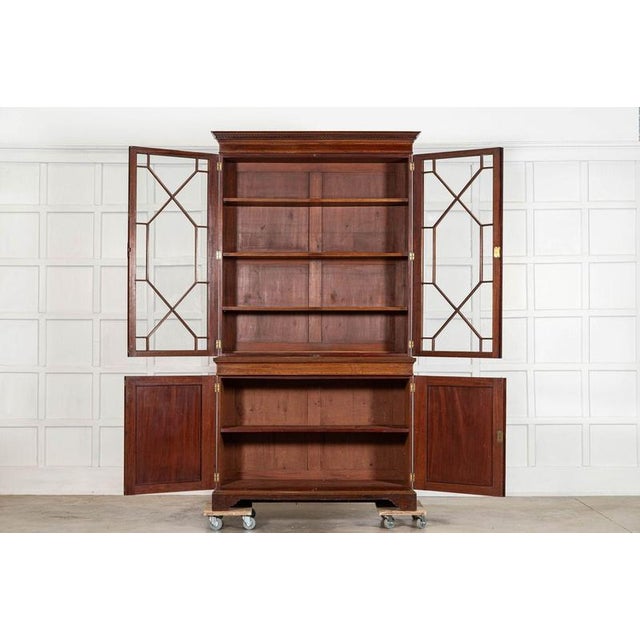 Circa 1870 english inlaid mahogany glazed bookcase together w130 x d45 x h234 cm base w125 x d45 x h94 cm base internal...