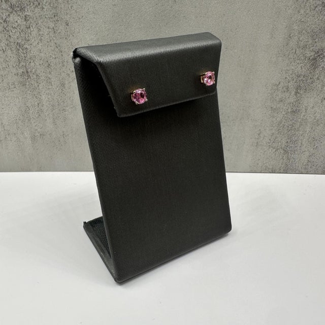 These stunning Pink Sapphire Stud Earrings in 14kt yellow gold feature 1.25ctw of natural round pink sapphires, showcasing...