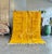 A bold and sophisticated Mrirt rug handwoven from natural wool by Berber artisans. Its rich golden ochre palette and...