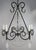 20th century hand wrought iron six light chandelier adorned with rock crystal pendulum shaped drops and garlands of...