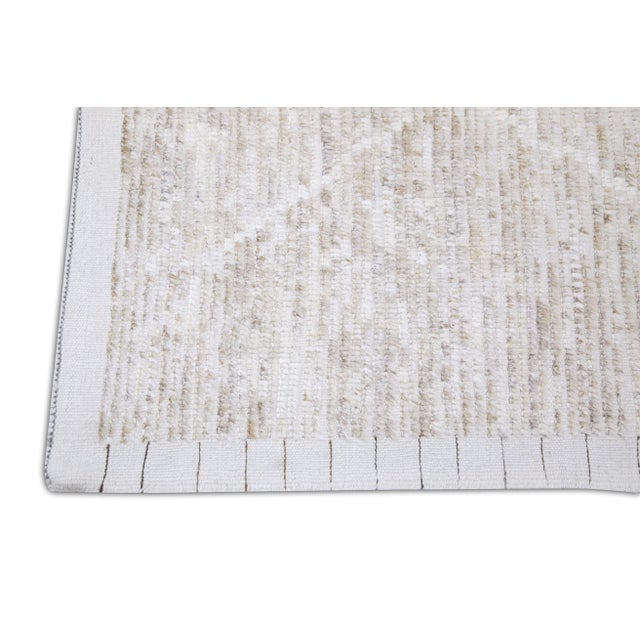 Introducing our exquisite handwoven wool modern Moroccan-style rug, a stunning blend of traditional craftsmanship and...