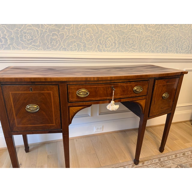Elegant antique Regency-style mahogany sideboard or server featuring beautiful satinwood banding and classic neoclassical...