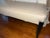 Early 21st Century Hollywood Regency Style Cream Leather Bench With Black Saber Legs & Nailhead Trim For Sale - Image 5 of 5