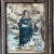 131/2" x 11 1/8" A stunning Mexican creation. A rectangle embossed tin frame holds the original hand drawn print of Saint...