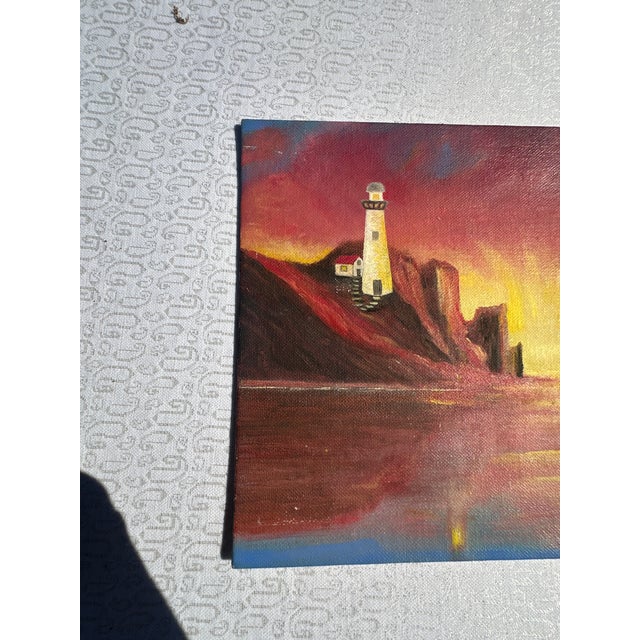 Up for consideration is a beautiful vintage lighthouse and sunset seascape painting on canvas. This would look lovely in...