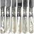 This set of six early 20th century fruit or desert knives feature mother-of-pearl handles, sterling silver ferrules, and...