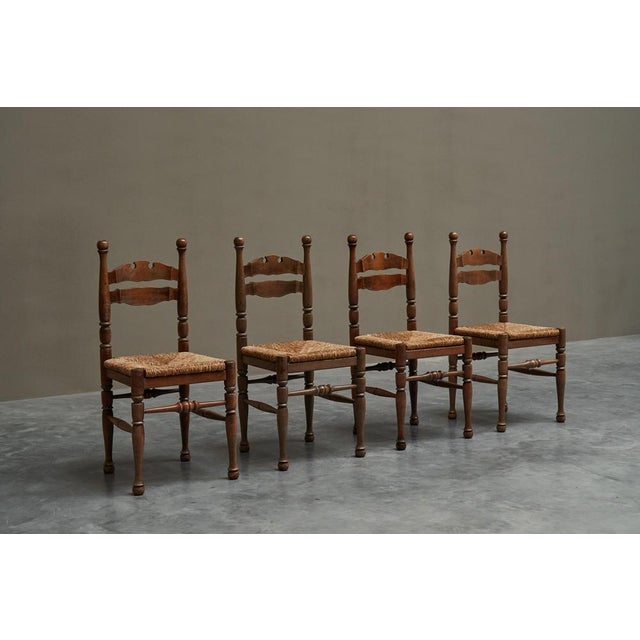 Set of 4 Whimsical Chairs in Oak and Rush, Europe, 1950s. This is a very delightful set of 4 chairs in solid oak and rush....