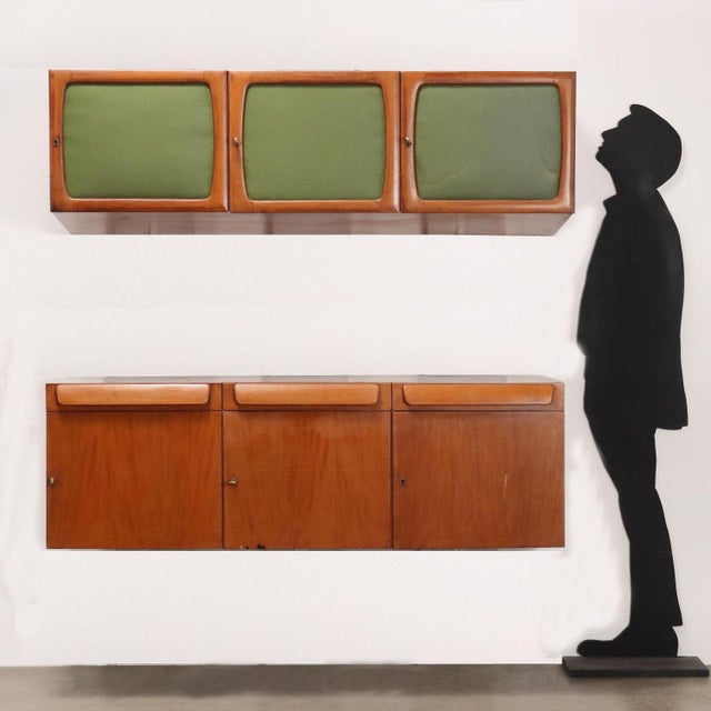 Pair of vintage wall units of Italian manufacture from the 20th century. Notable for their architectural forms, the first...