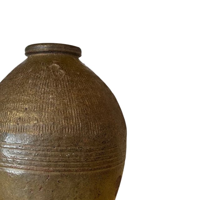 Bring the sun-drenched landscapes of rural Turkey into your home with this vintage ceramic vase. Handcrafted by skilled...