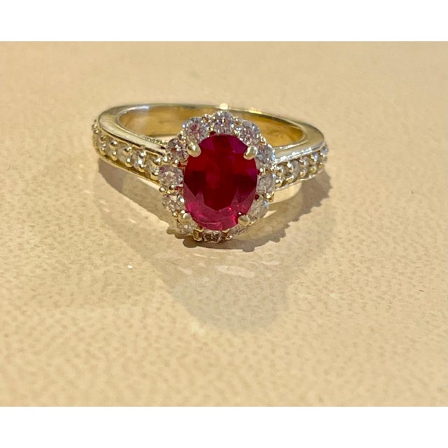 Gemstone Oval 1.5 Carat Treated Ruby and 1.20 Carat Diamond 14 Karat Yellow Gold Ring For Sale - Image 7 of 18