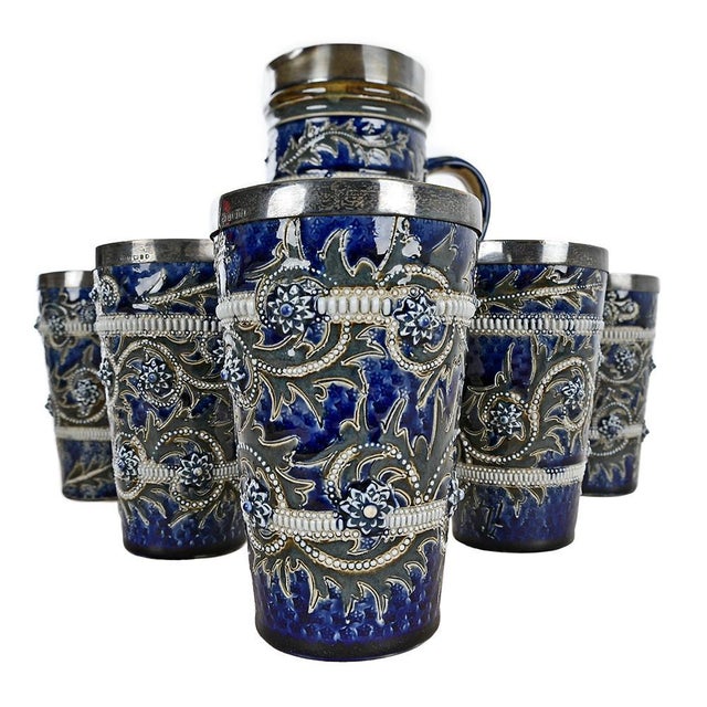 This orangeade service by Leuchar & Son is a true gem of earthenware craftsmanship. Comprised of a carafe and five...