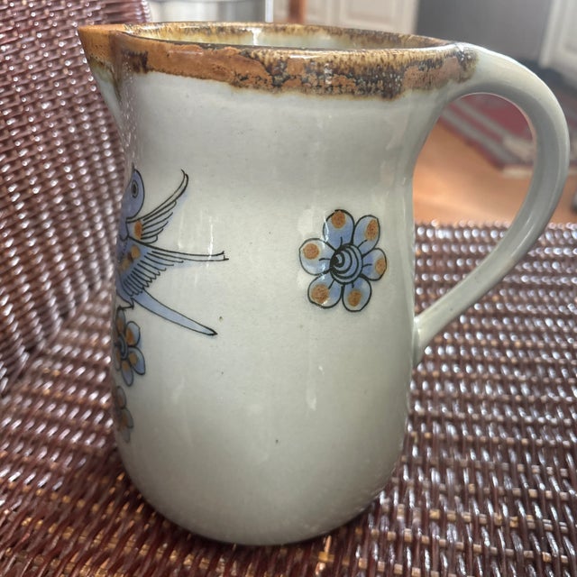 Tonala Hand Painted Pitcher with Birds, Butterflies, and Flowers. This pitcher is Ken Edwards El Palimar, which he started...