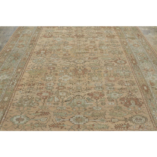 Hand-knotted in wool circa 1900-1920, this 9x12 antique Turkish Ghiordes rug is an exceptionally refined textile. This...
