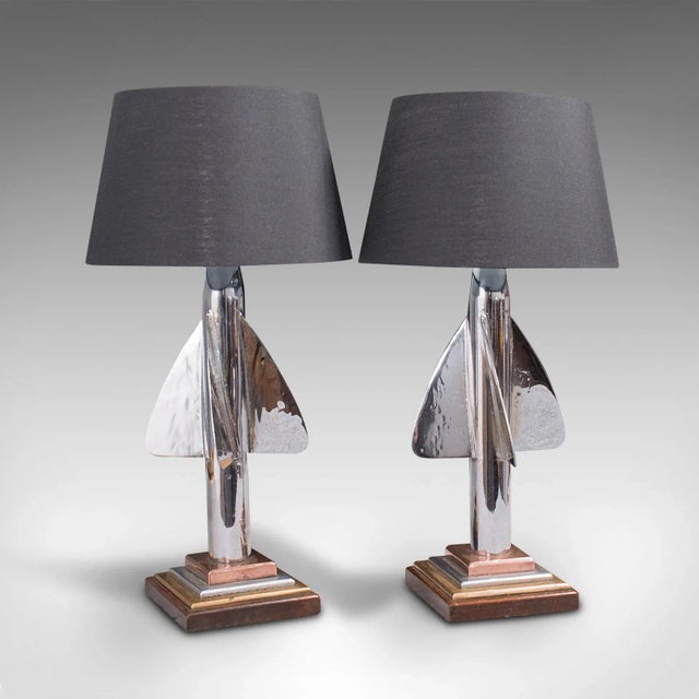 This is a pair of vintage maritime desk lamps. An English, chromed ship's log trailing fin table light, dating to the...