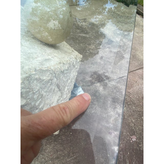 1980’s period Tessellated stone coffee table. Chiseled travertine marble look with smooth simulated travertine ball with...