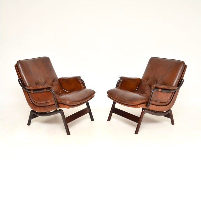 A stylish and very comfortable pair of vintage Danish leather armchairs. They were recently imported from Denmark, they...