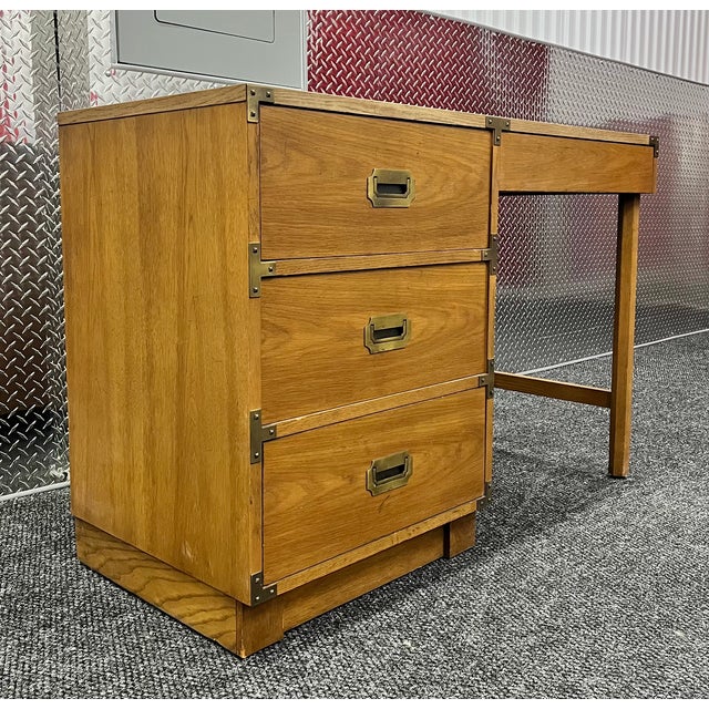 Add timeless mid-century sophistication to your workspace with this classic Drexel campaign-style desk. Masterfully...