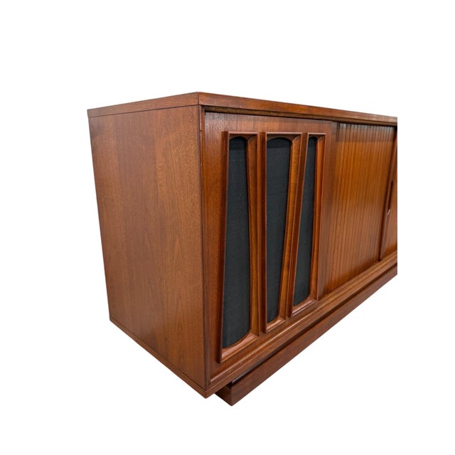 Presenting this exceptional Mid-Century Modern Tambour Walnut Media Cabinet Sideboard, circa 1960s, beautifully refinished...