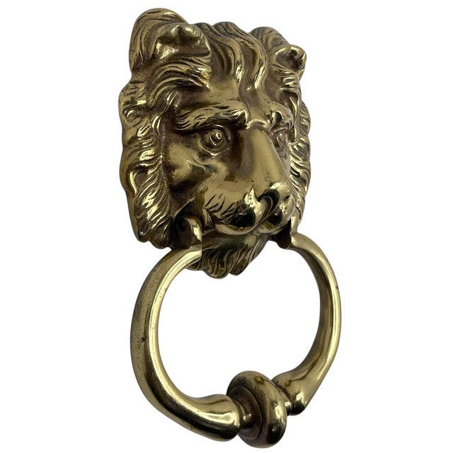 An impressive lion's head door knocker on a large door, such as the ones mounted on many fine London mansions, always...