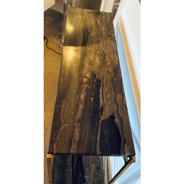 Original retail $2690, stylish Currey & Company Modern Brown Marble Flying Console Table, textured gold frame, showroom...