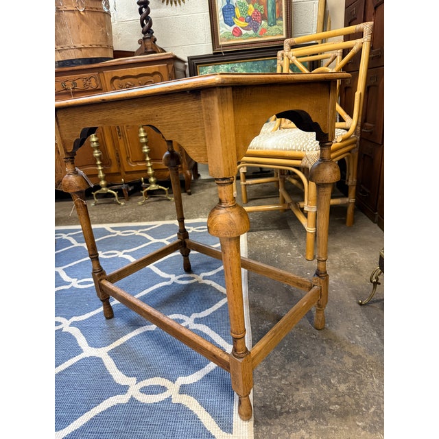 A charming antique English oak side table, dating to the late 19th to early 20th century, showcasing classic country...