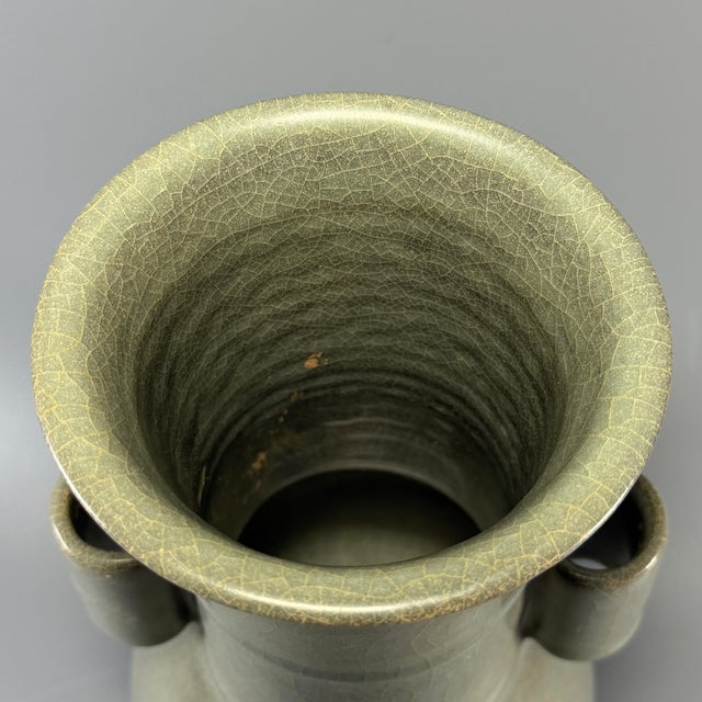 This antique Chinese Longquan celadon vase features classic arrow ear (guan er) design on both sides. The glaze has fine...