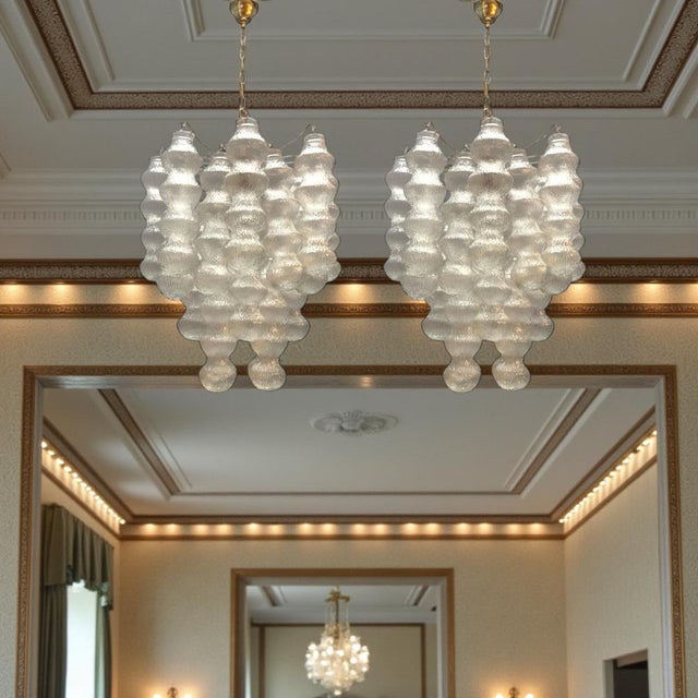 This stunning pair of Murano Bubble Chandeliers from the 1980s features an eye-catching design with a series of...