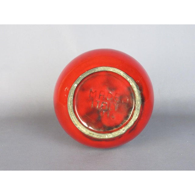 A vibrant, modernist-style, glossy glazed ceramic bottle vase, attributed to an italian ceramics manufacturer from the...