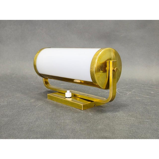 Original bauhaus wall lamp from 1930s czechoslovakia, defined by its clean cylindrical form and balanced proportions. The...