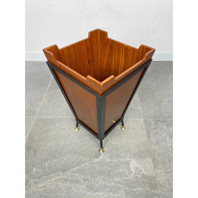 1960s basket in teak and metal details with brass feet, made in Italy.