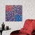 Overlapping dots of navy, cobalt, periwinkle, coral red, pink, peach and plum fill the square, the warm colors gathered in...