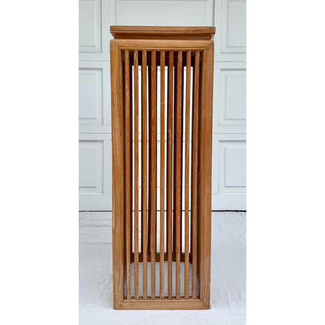 Here is a fantastic pedestal/stand featuring cerused wood in a modern shape with a slatted design. The "slats" are rounded...