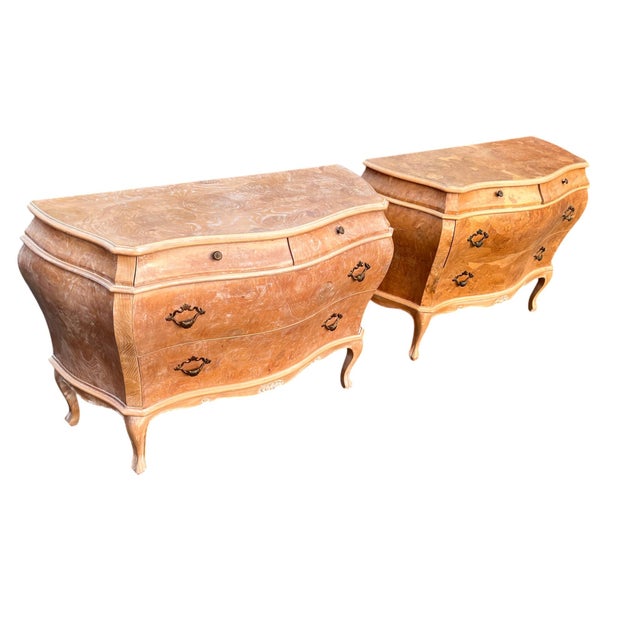Pair of Italian Bombe Commodes by Decorative Crafts Inc. in Burl Veneer An elegant pair of Italian bombe commodes imported...
