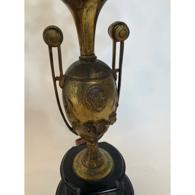 Elevate your space with this exquisite pair of vintage candelabra lamps, where French Empire elegance meets timeless...