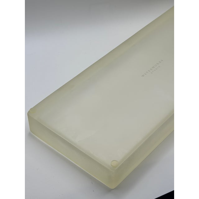 Elegant and minimalist Waterworks vanity tray crafted in thick frosted glass with a refined raised edge. Designed for...