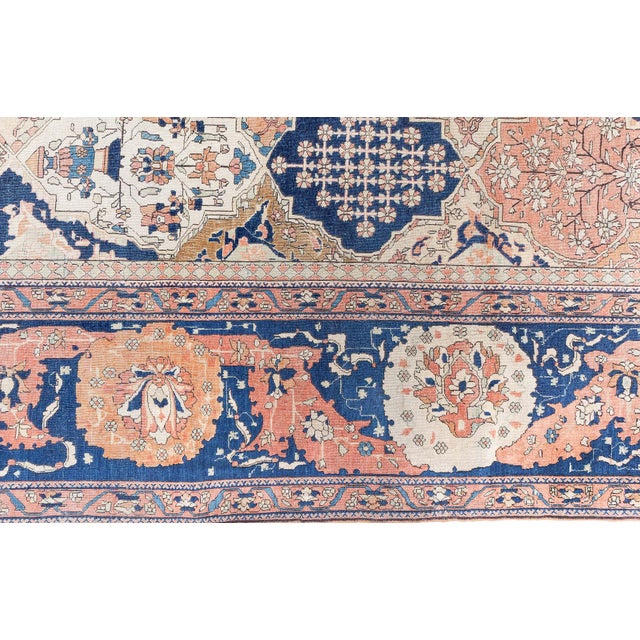 A breathtaking display of classical Persian artistry, this antique Kashan rug captivates with a rare and ornate lattice...