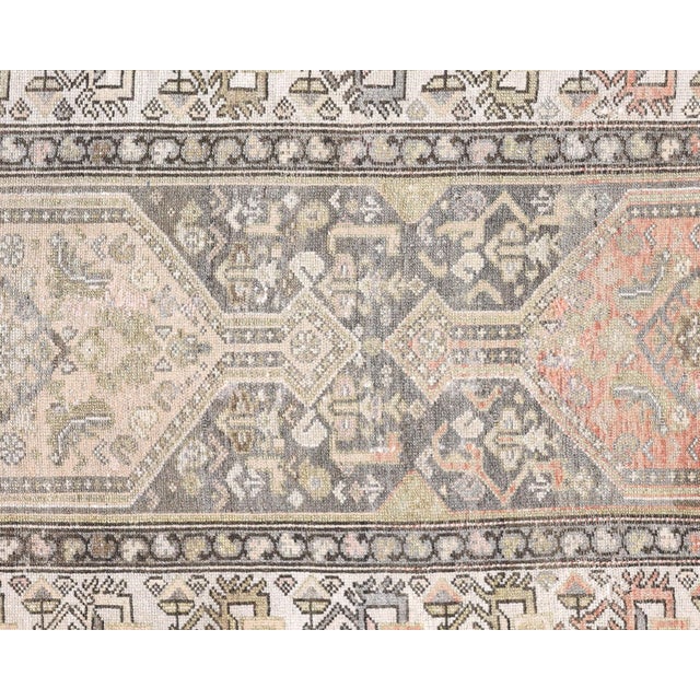 Crafted in Iran's esteemed Hamadan region, this semi-antique Melayer runner exemplifies the sophisticated artistry...